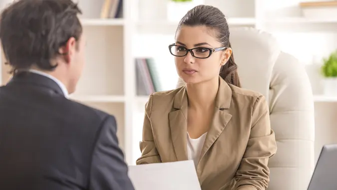 young businesswoman interviewing man