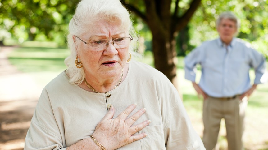 A senior woman experiencing chest pain.