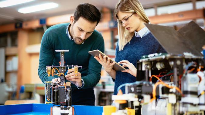 10 Best and Worst Industries for Work-Life Balance, Robotics engineer students teamwork on project