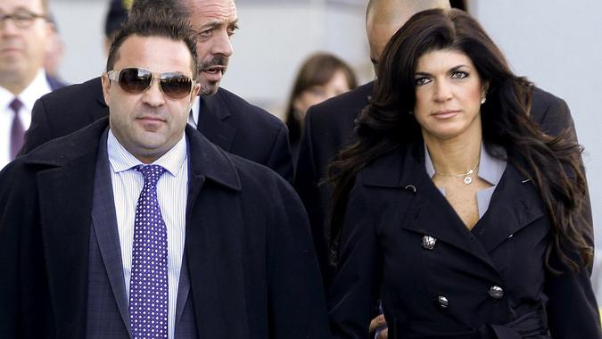 Joe and Teresa Giudice walking to court after being indicted