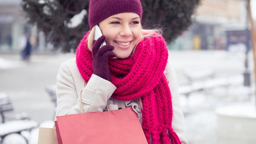 woman in the snow on the phone