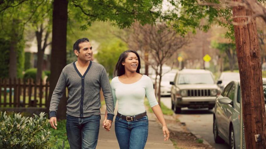 couple walking through neighborhood