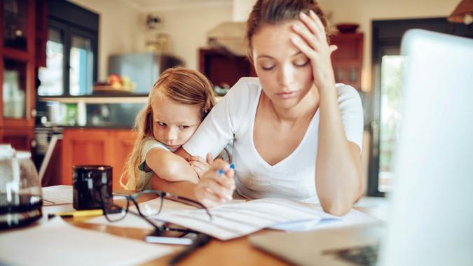 Forgetting to File Your Return Close up of a mother going through her financials.