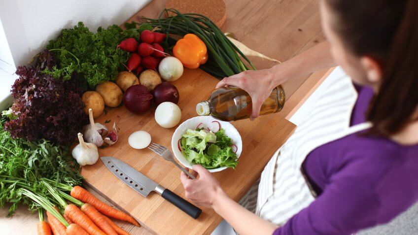 woman making a veggie salad