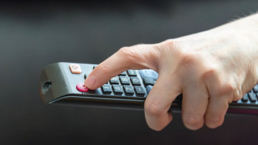 hand with tv remote control