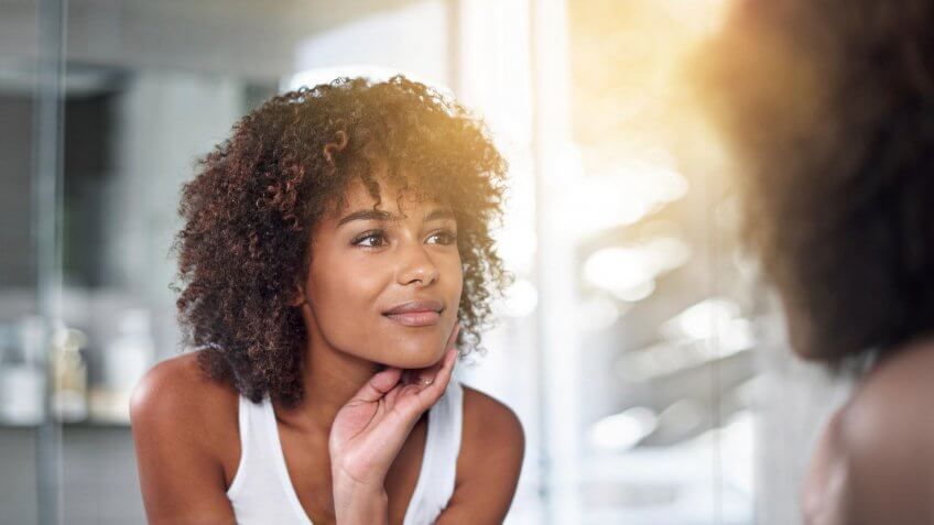woman looking in the mirror