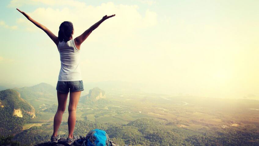 girl at the top of a mountain