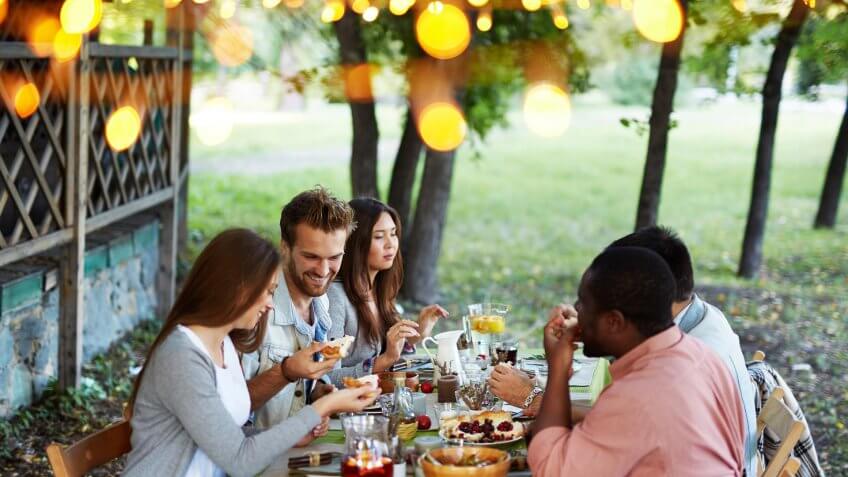 group of friends having dinner outside