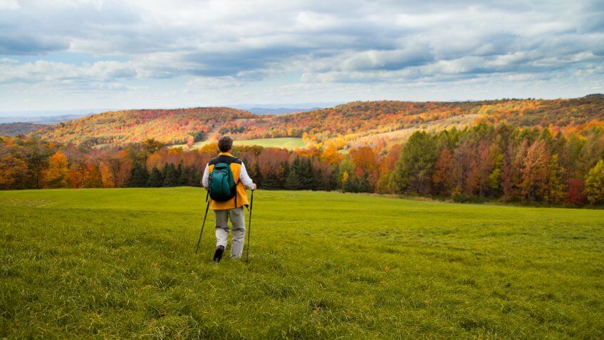 Senior man hiking in Autumn setting.
