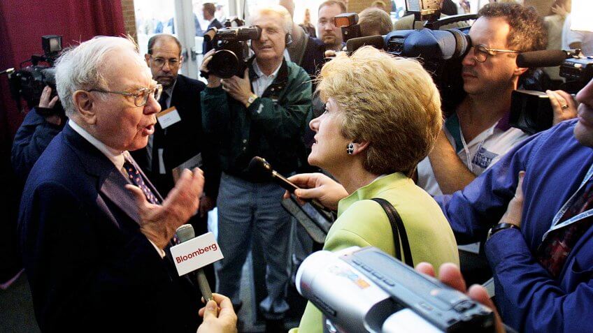 404925 01: Warren Buffett of Berkshire Hathaway talks to members of the media May 4, 2002 at the annual Berkshire Hathaway shareholders meeting in Omaha, Nebraska.