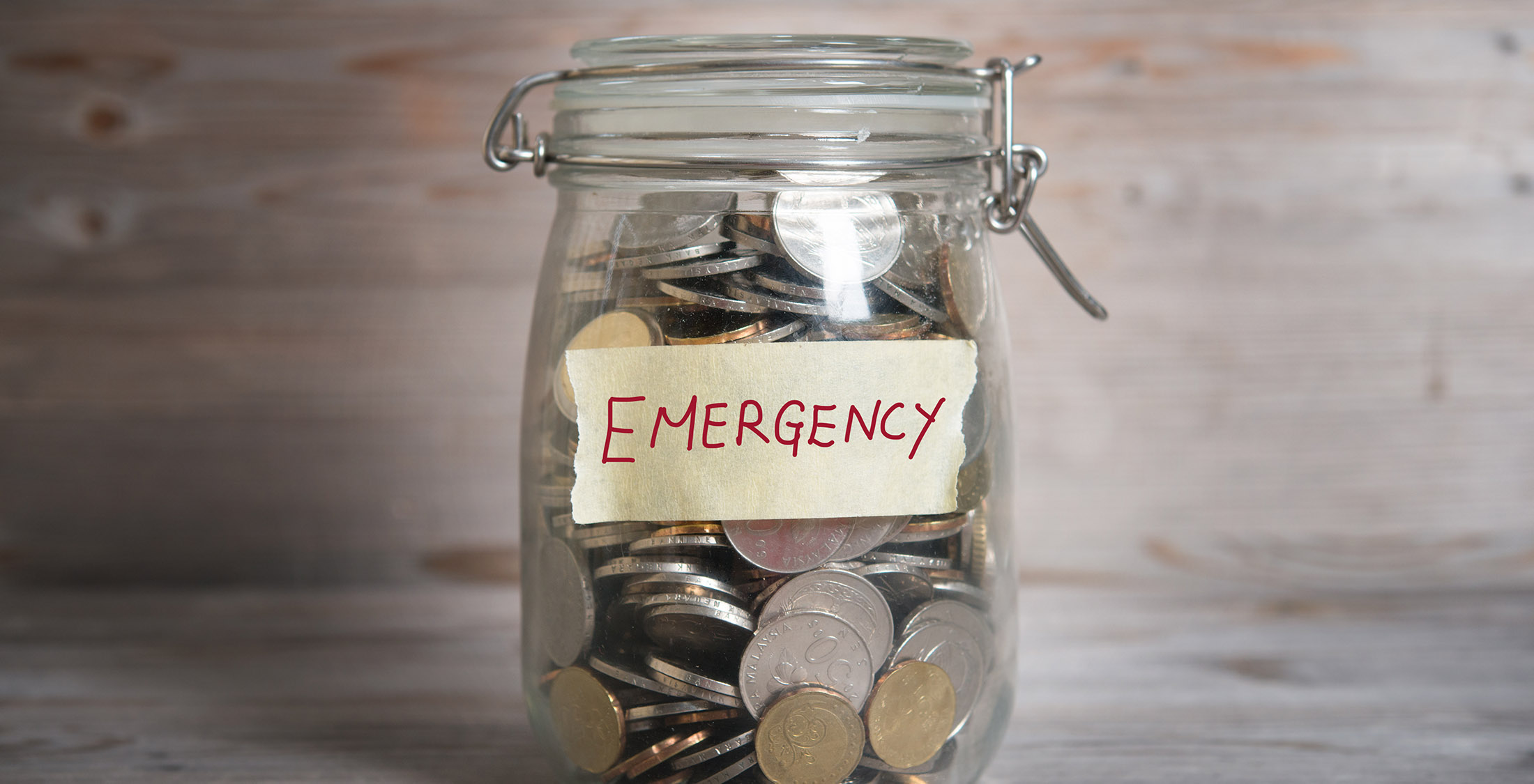 Ensure your financial health before you invest emergency jar filled with coins