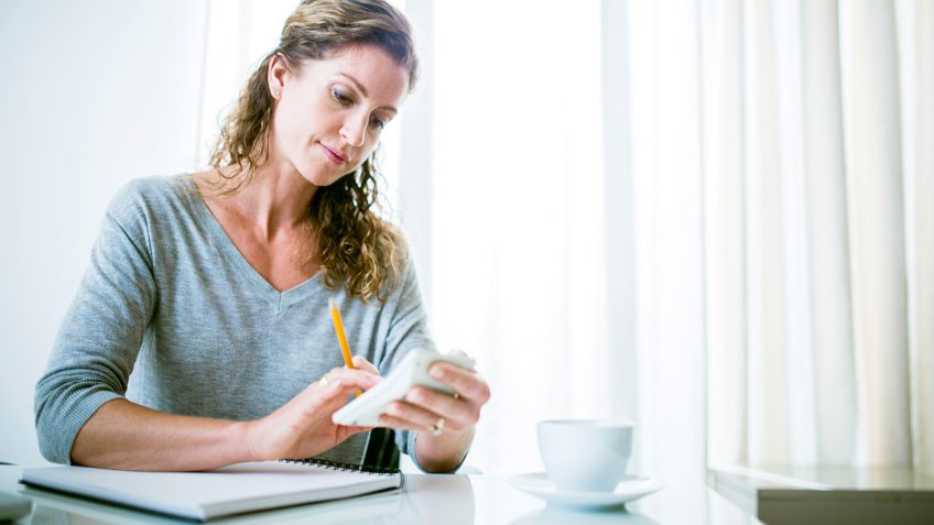 woman using a calculator