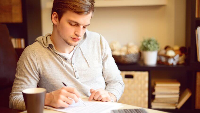 young man budgeting his finances