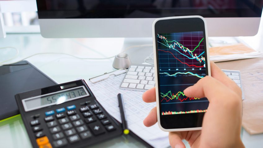 using a smartphone to check the stock market