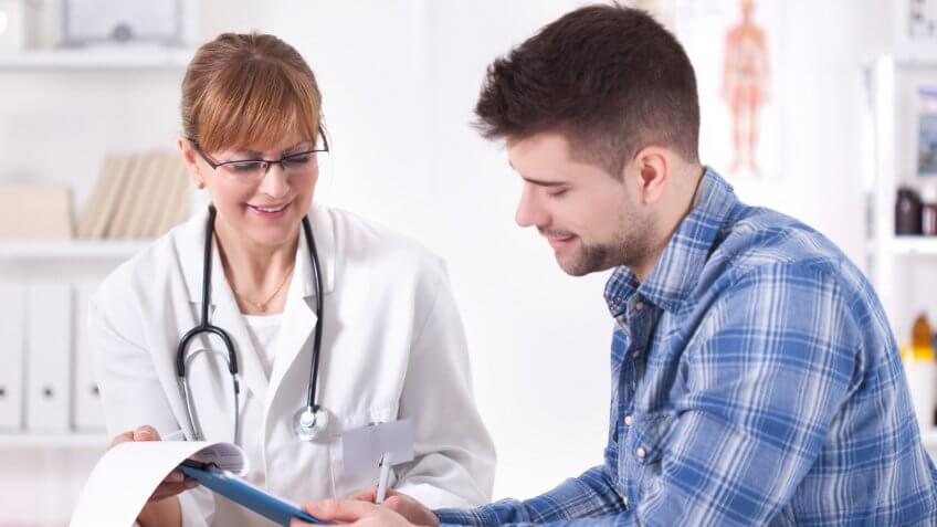 young man speaking to a female doctor