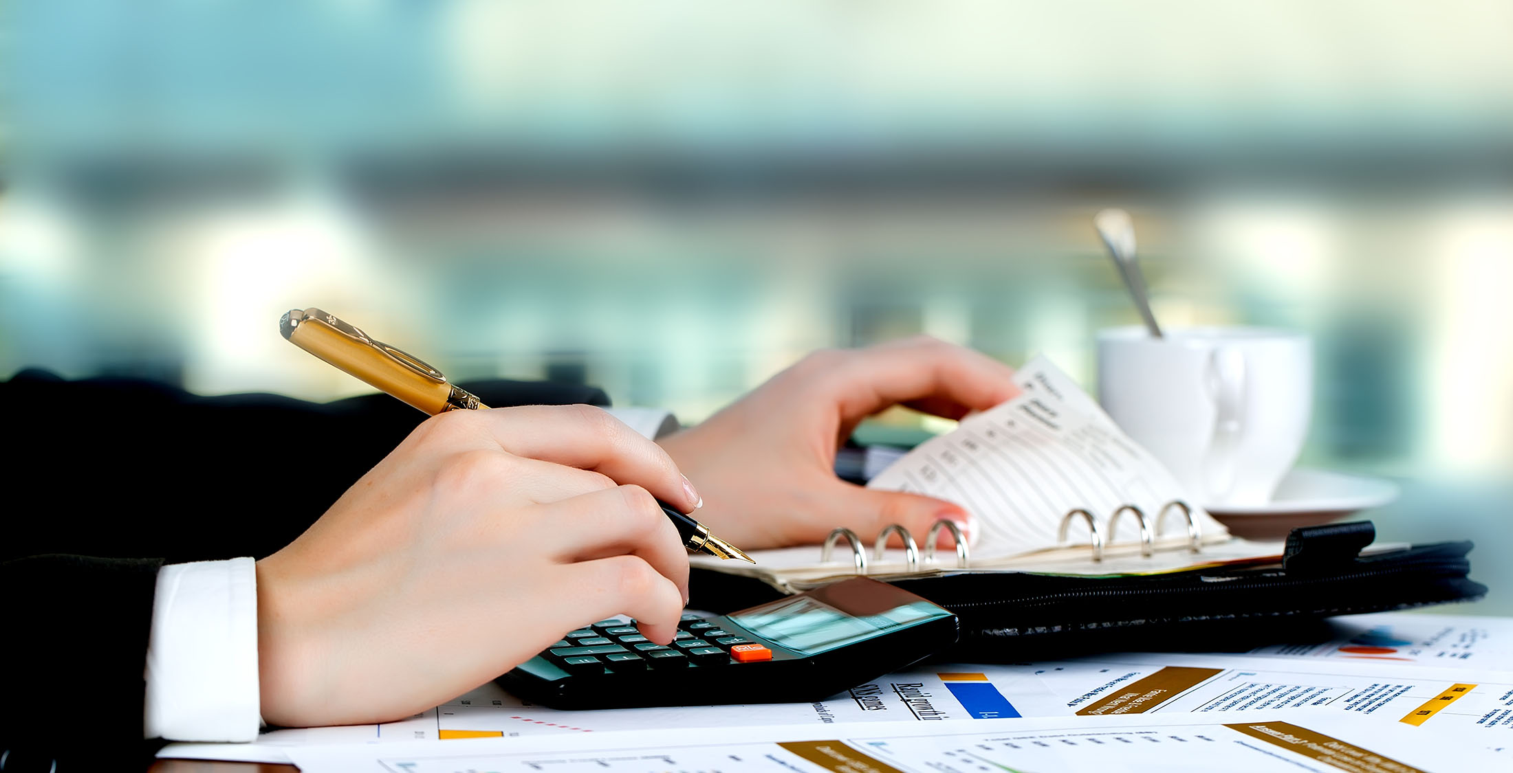 Choose Exchange-Traded Funds hands making calculations at desk