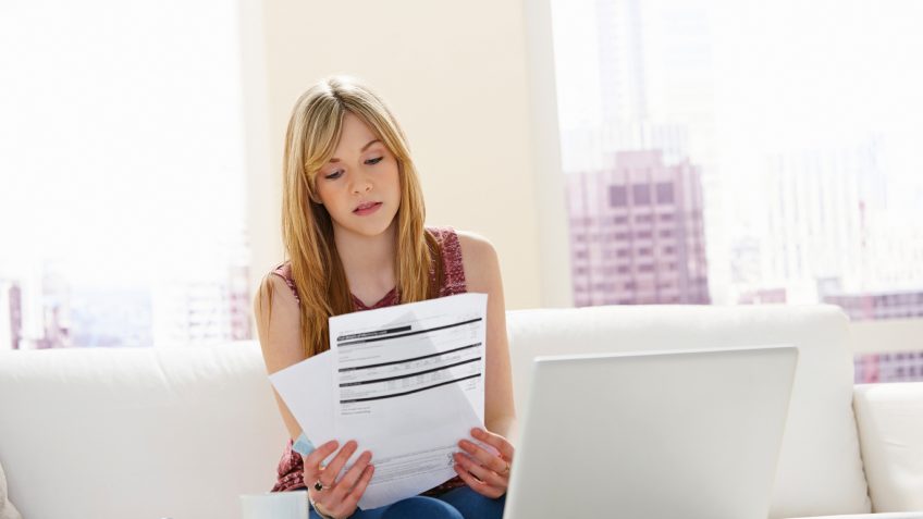 woman looking at her investment statements