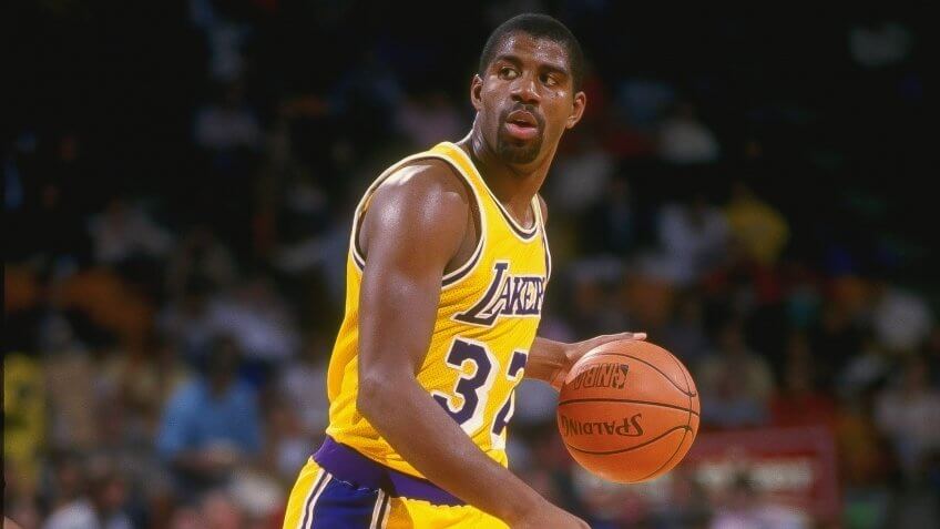 1987: Guard Magic Johnson of the Los Angeles Lakers dribbles the ball during a game at the Great Western Forum in Inglewood, California.
