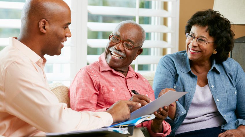 Retirees talking to finance professional