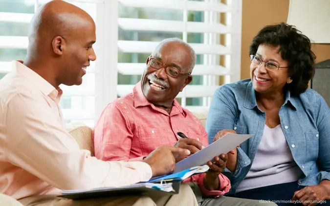 Retirees talking to finance professional