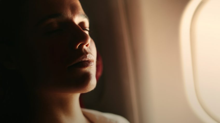 woman relaxing on an airplane