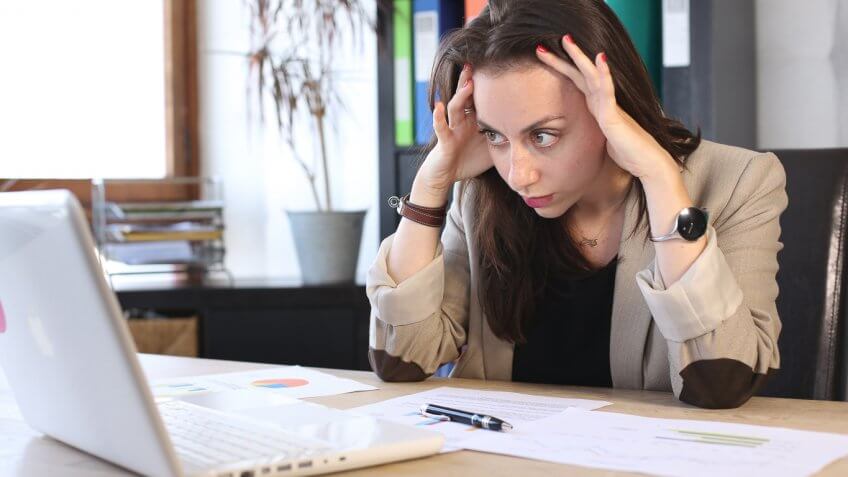 frustrated young woman using a laptop frustrated young woman using a laptop