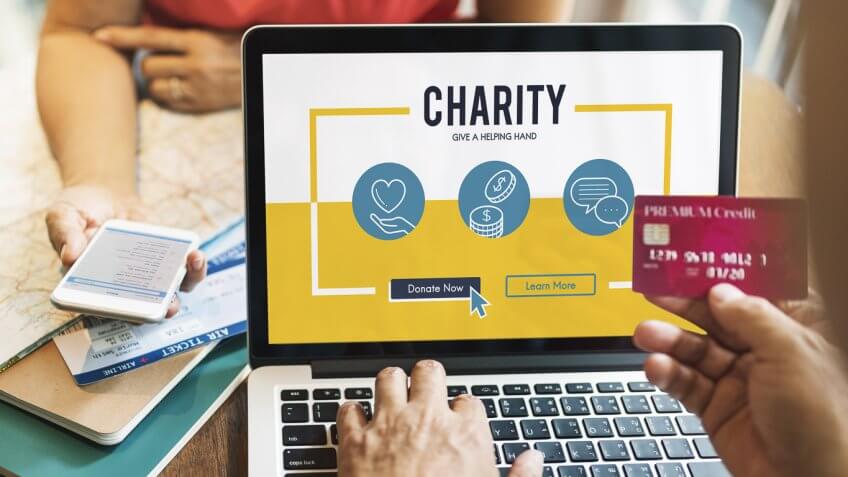 person donating to a charity online person donating to a charity online