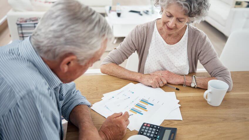 senior couple reviewing their financial investments