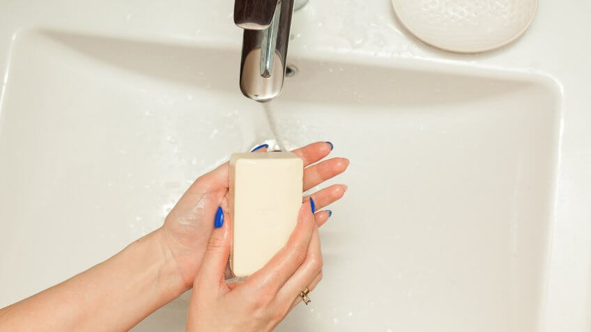 woman using bar hand soap
