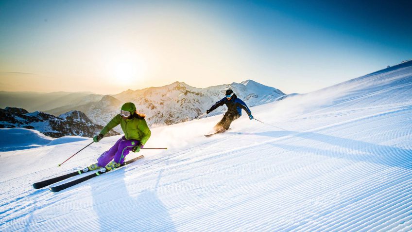 skiers going down a mountainside