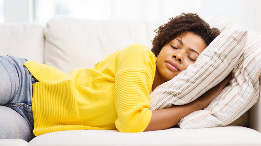 young woman sleeping on a couch