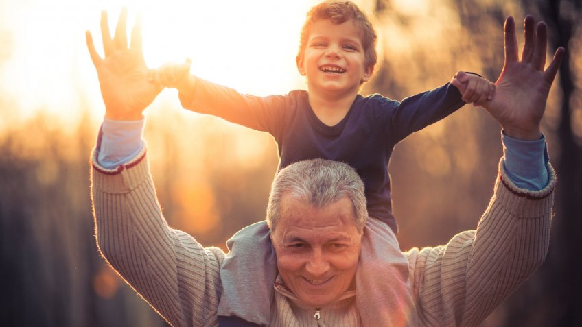 grandfather playing with his grandson