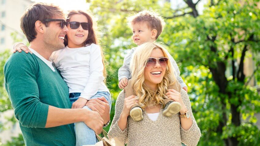 young family outside in the sun