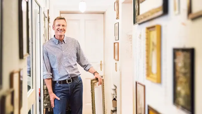 Adult, Art Collector in old Apartment Corridor - Stock imagePicture Fr, men, people, smiling