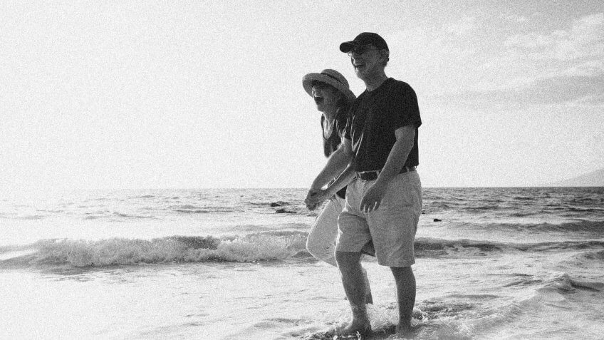retired couple spending time together on the beach