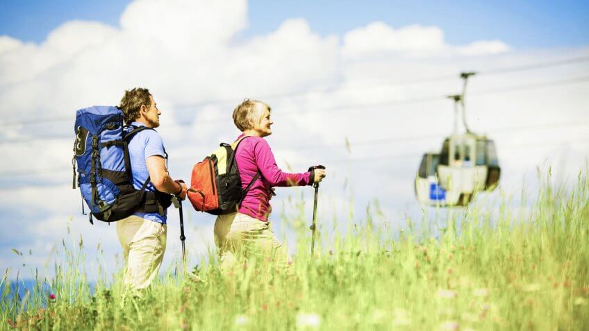 older man and woman on a hike