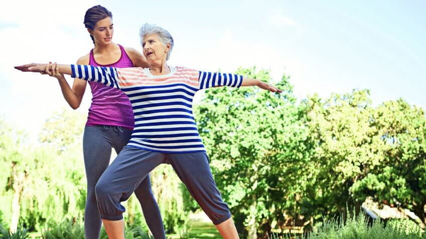 older woman doing yoga
