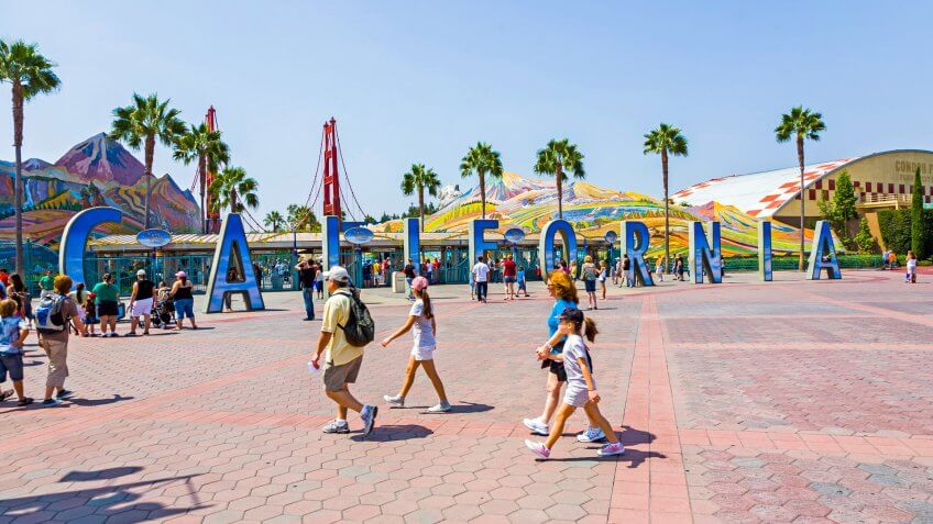 Anaheim, USA - July 29, 2008: people visit disneyland and walk over commemorative bricks with names in terracotta in Anaheim, USA.