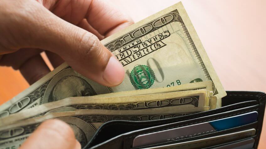 20-24 years, Businessman, Counting, Credit Card, High Angle View, Luxury, One Person, One Young Man Only, Opening, Removing, Studio Shot, Wealth, What $100 Was Worth in the Decade You Were Born, Young Adult, abundance, african ethnicity, beige, cash, close up, color image, colored background, finance, fistful, funds, hand, horizontal, hundred dollar bill, man, mixed race person, money, people, photography, reward, success, wallet