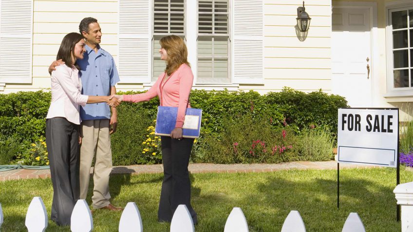 couple meeting with a real estate agent