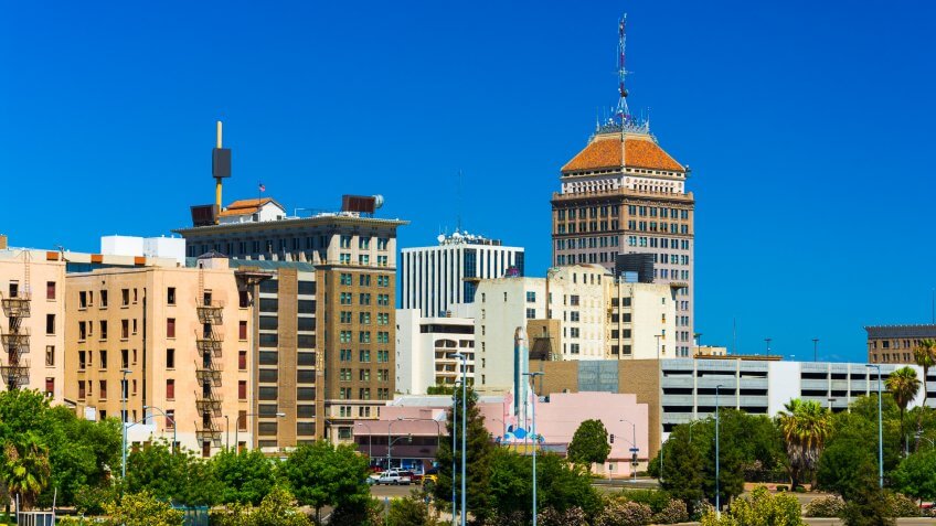 Fresno downtown skyline view with a clear blue sky in the background.