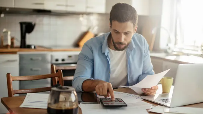 Photo of a man going through his financials problems.