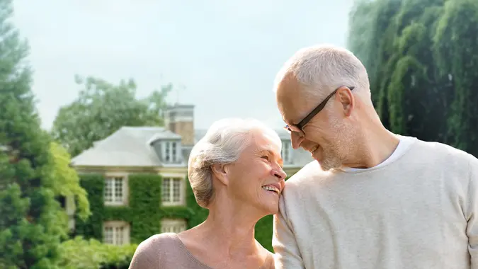 senior couple with house.