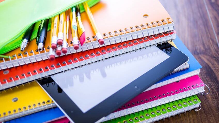 10 Items You Should Never Get at the Dollar Store, 2015, Back to School, Bring Your Own Device, Colored Pencil, Digital Tablet, Equipment, Eraser, Internet, Multi Colored, No People, Office, Office Supply, Pencil, School Supplies, Spiral Notebook, Technology, Touchpad, Yellow, education, horizontal, indoors, photography
