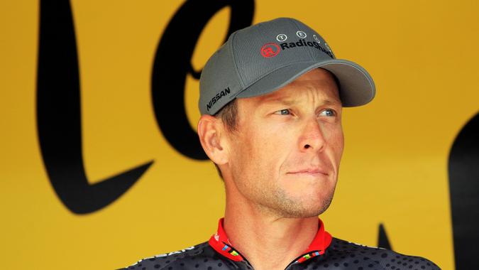 RODEZ, FRANCE - JULY 17:  Lance Armstrong of the USA and Team Radioshack signs on at the start of stage thirteen of the 2010 Tour de France from Rodez to Revel on July 17, 2010 in Revel, France.