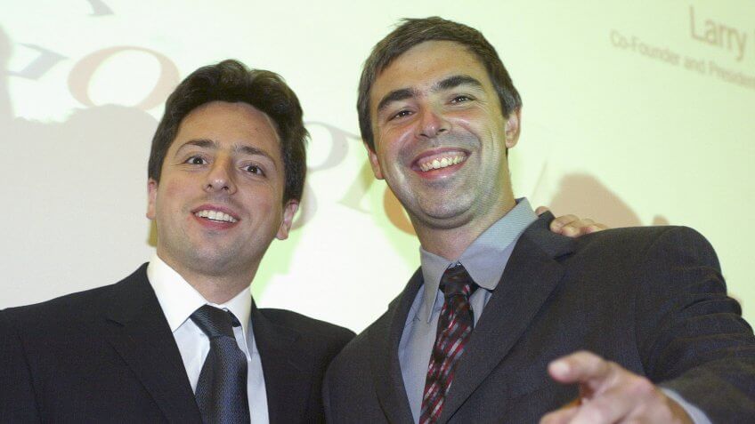 FRANKFURT, GERMANY - OCTOBER 7: Google founders Sergey Brin (L) and Larry Page (R) joke prior to a news conference during the opening of the Frankfurt bookfair on October 7, 2004 in Frankfurt, Germany.
