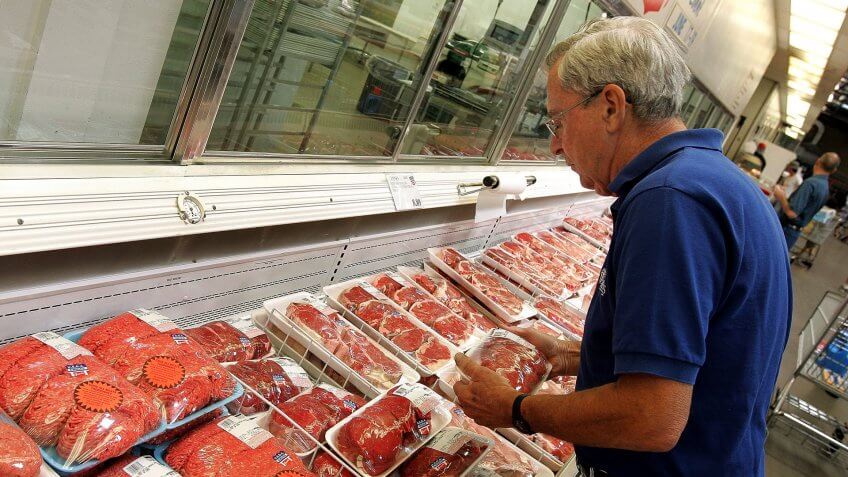 NILES, IL - JUNE 16: Ray Carey shops the premium brand Kirkland Signature meat section at a Costco store June 16, 2005 in Niles, Illinois.