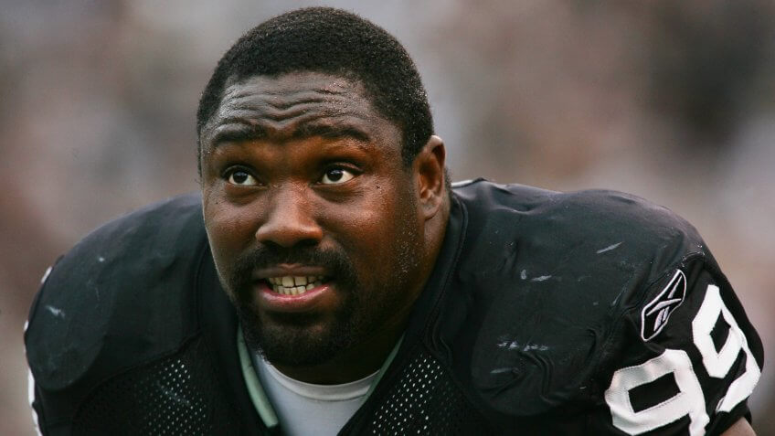 OAKLAND, CA - OCTOBER 17: Warren Sapp #99 of the Oakland Raiders looks on from the sideline during the game against the Denver Broncos at Network Associates Coliseum on October 17, 2004 in Oakland, California.