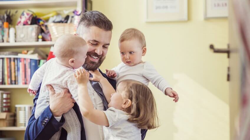 Increase wages for working families. dad with three young children