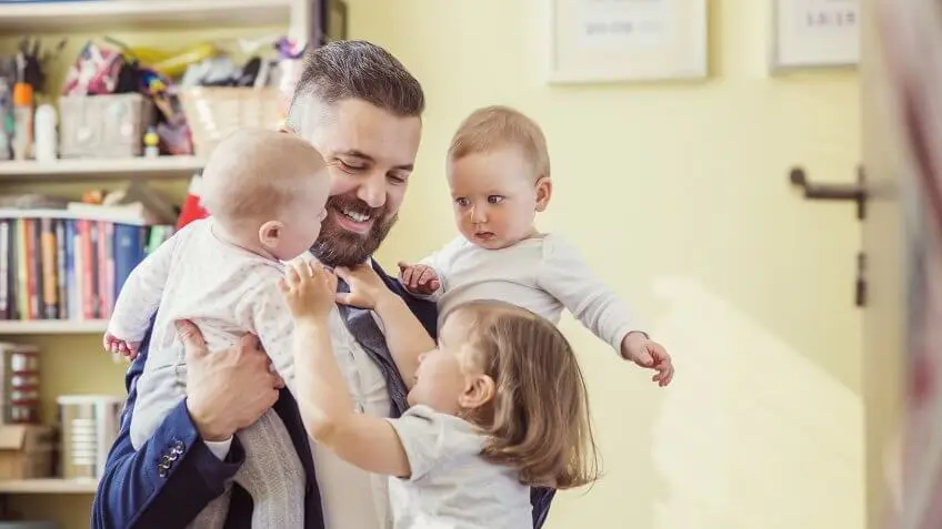 Increase wages for working families. dad with three young children